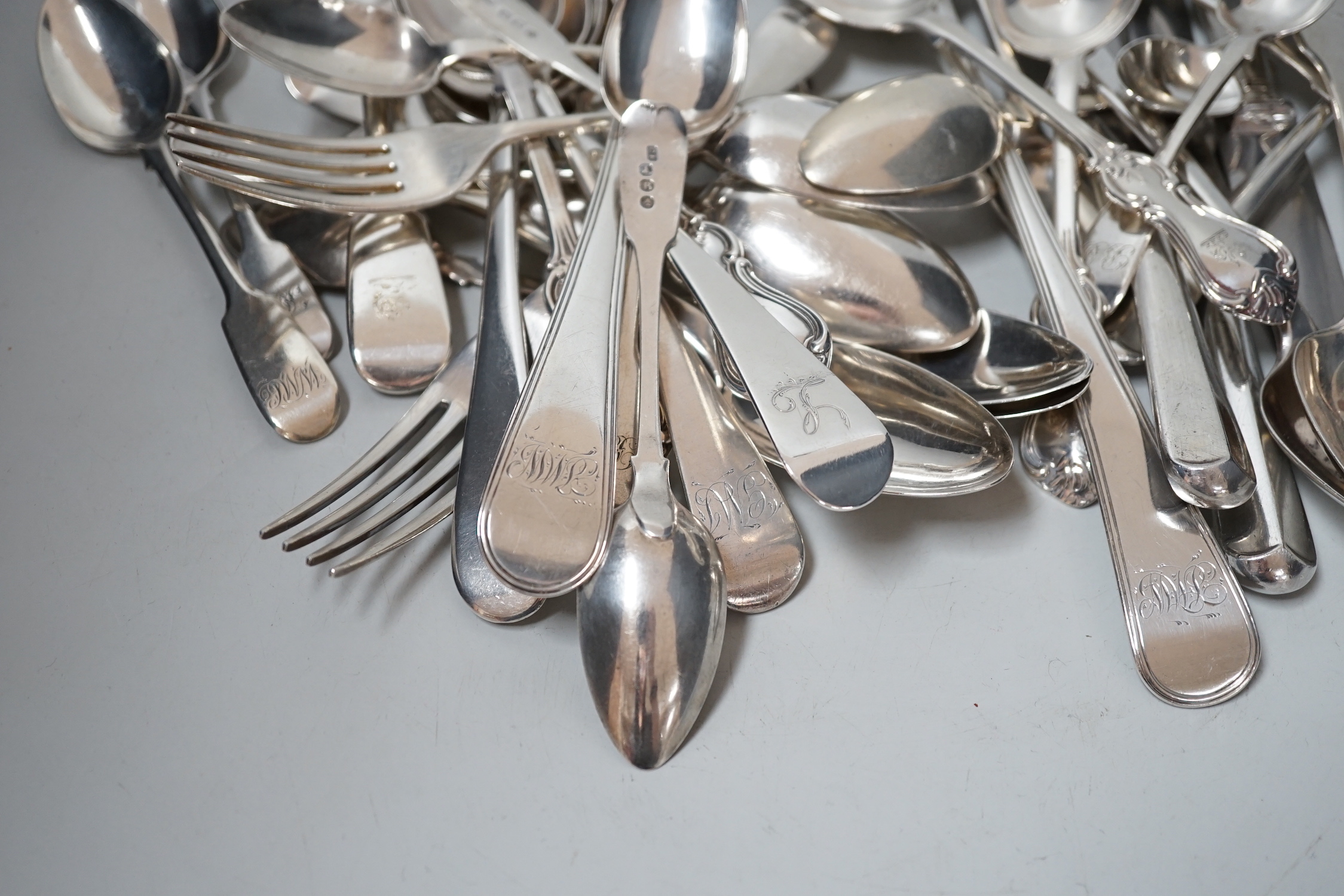 A canteen of mixed George III and later silver flatware, various patterns, dates and makers, 48.6oz.